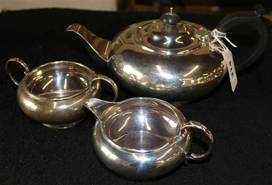 Silver three-piece tea set, of plain flattened circular form, London 1930, C S Harris & Sons Ltd